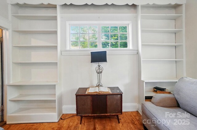247 W Park Ave, Charlotte, NC 28203 - sitting room featuring wood finished floors, baseboards, and built in features
