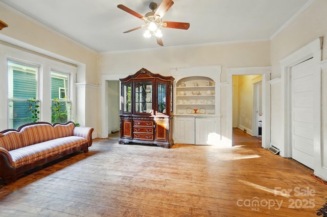 247 W Park Ave, Charlotte, NC 28203 - living area with light wood-style flooring, ornamental molding, and a ceiling fan
