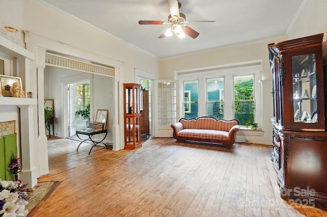 247 W Park Ave, Charlotte, NC 28203 - living area featuring light wood-type flooring, a ceiling fan, and crown molding