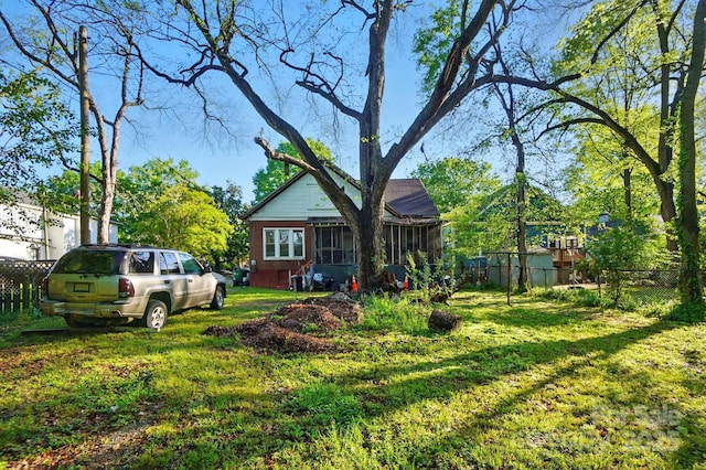 247 W Park Ave, Charlotte, NC 28203 - view of yard with a sunroom and fence
