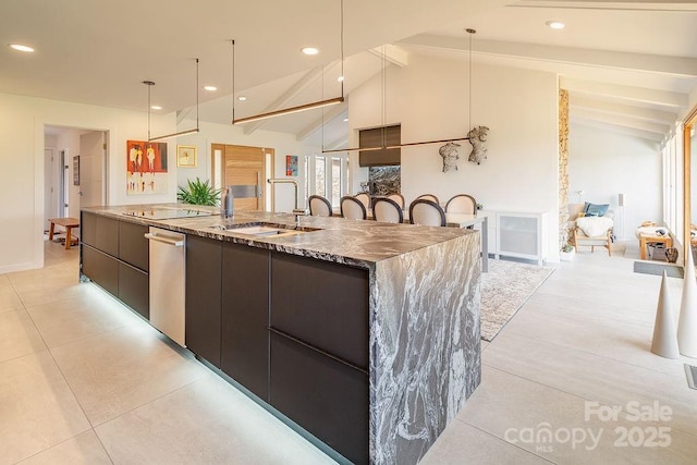 kitchen with stainless steel dishwasher, vaulted ceiling with beams, a sink, and modern cabinets