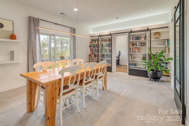 dining room with a barn door