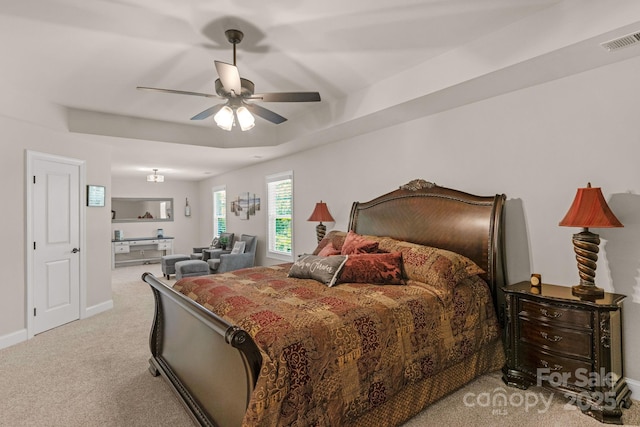 bedroom with light colored carpet, baseboards, visible vents, and a ceiling fan
