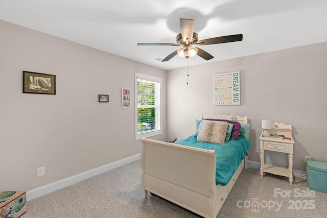 carpeted bedroom with baseboards and ceiling fan