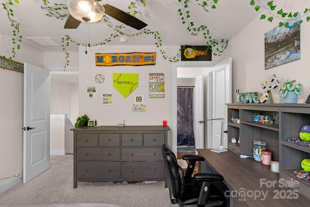 office space with carpet floors, a ceiling fan, and baseboards