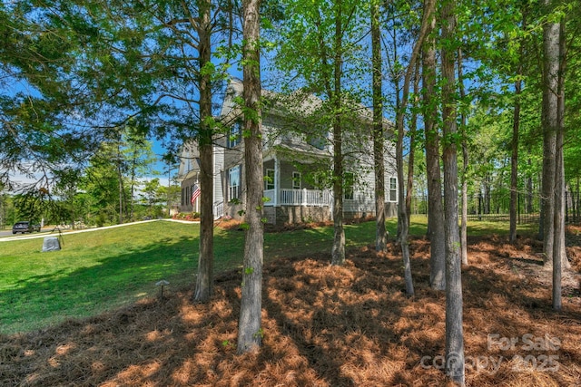view of yard featuring a porch