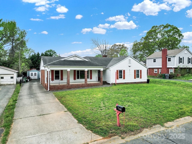 bungalow-style house with a front yard, a porch, an outdoor structure, and brick siding
