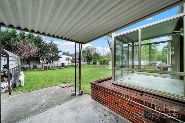view of patio with a sunroom