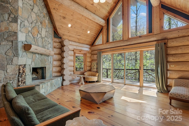 living room with rustic walls, wooden ceiling, beam ceiling, high vaulted ceiling, and hardwood / wood-style floors