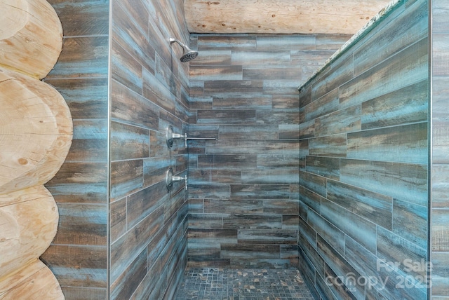 bathroom with tiled shower