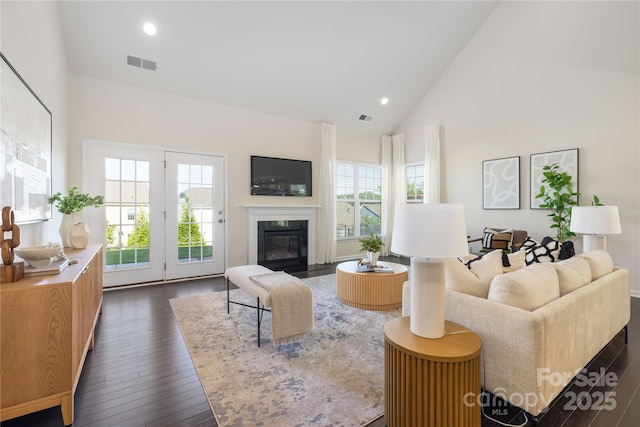 1005 Argentium Way, Waxhaw, NC 28173 - living room with dark wood-type flooring, high vaulted ceiling, a fireplace with flush hearth, and recessed lighting