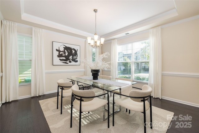 1005 Argentium Way, Waxhaw, NC 28173 - dining room featuring a tray ceiling, crown molding, a chandelier, and dark wood-style flooring