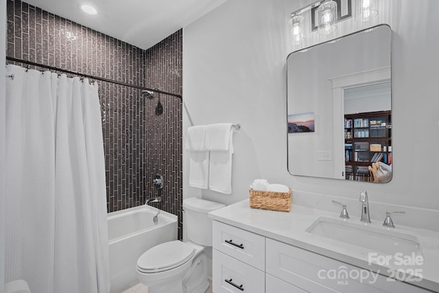 full bathroom with vanity, toilet, and shower / tub combo