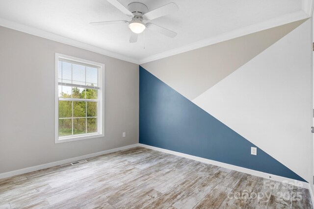 123 Pumice Dr, Statesville, NC 28625 - empty room with crown molding, wood finished floors, ceiling fan, and baseboards