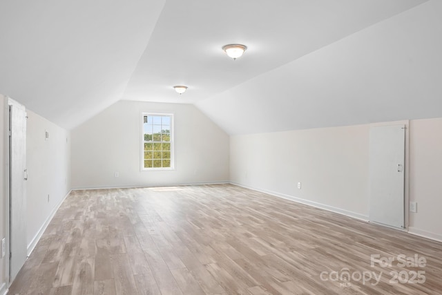 123 Pumice Dr, Statesville, NC 28625 - additional living space featuring light wood-type flooring, lofted ceiling, and baseboards
