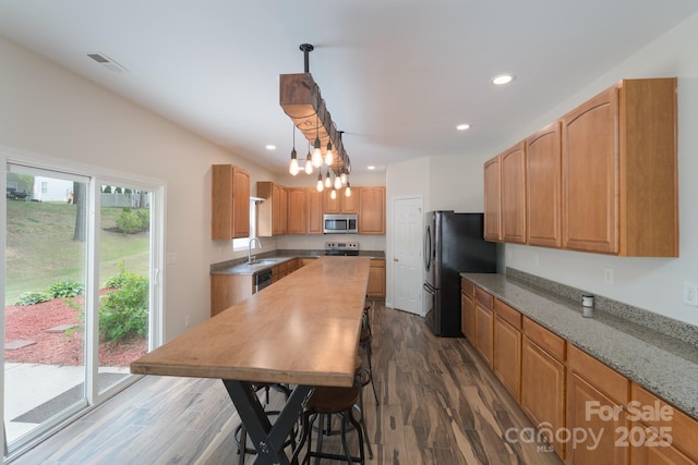 1144 Spicewood Pines Rd, Fort Mill, SC 29708 - kitchen with stainless steel appliances, a sink, dark wood-style flooring, light stone counters, and recessed lighting