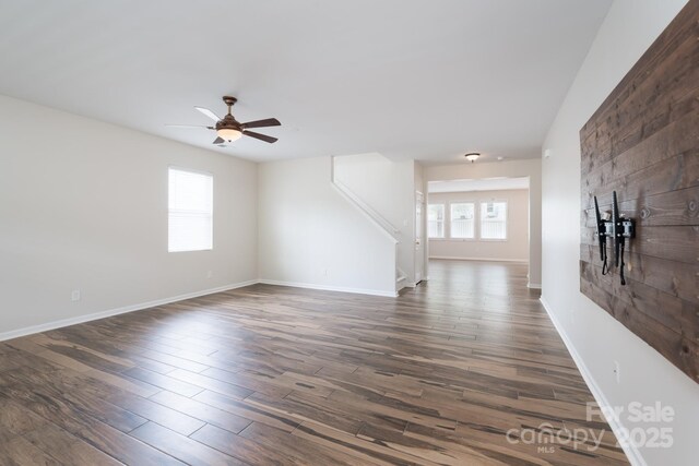 1144 Spicewood Pines Rd, Fort Mill, SC 29708 - unfurnished living room featuring ceiling fan, dark wood finished floors, stairway, and baseboards