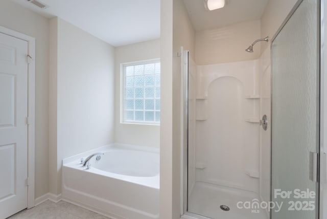 1144 Spicewood Pines Rd, Fort Mill, SC 29708 - full bathroom featuring a shower stall, a garden tub, tile patterned floors, and baseboards