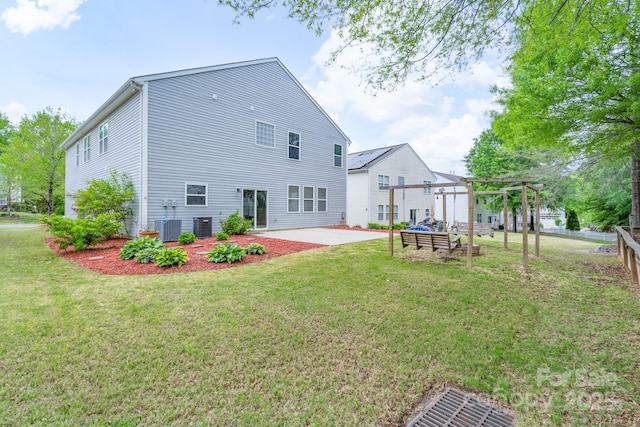 1144 Spicewood Pines Rd, Fort Mill, SC 29708 - rear view of property featuring a pergola, a patio area, a lawn, and central AC unit