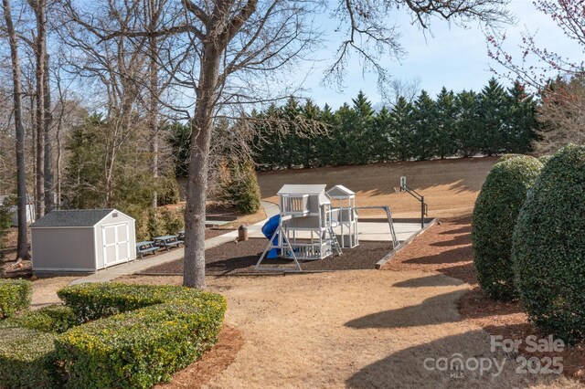 1144 Spicewood Pines Rd, Fort Mill, SC 29708 - view of yard with a playground, a storage unit, and an outdoor structure
