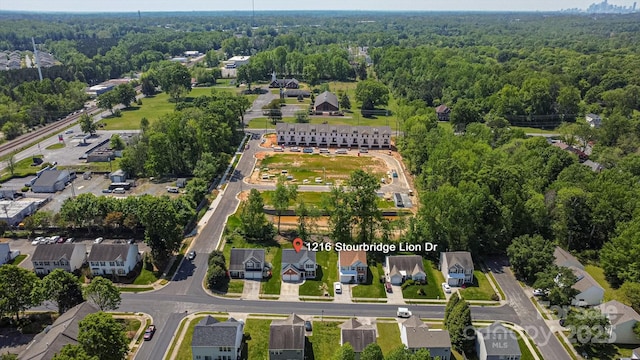 bird's eye view with a residential view and a wooded view