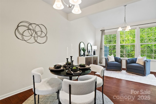 dining space featuring plenty of natural light, vaulted ceiling, baseboards, a chandelier, and dark wood-type flooring