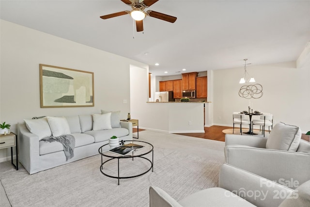 living room with baseboards, recessed lighting, and ceiling fan