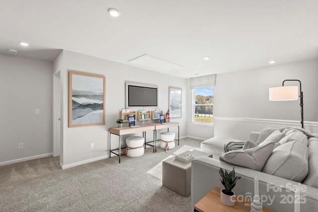carpeted living room featuring baseboards, recessed lighting, and attic access