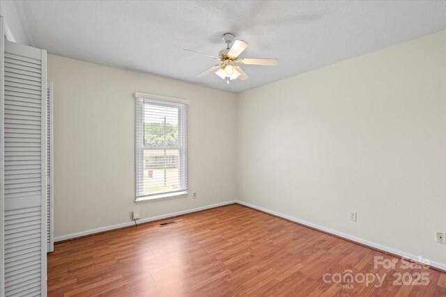 1504 Andicot Ln, Shelby, NC 28152 - unfurnished bedroom featuring wood finished floors, a closet, and a ceiling fan