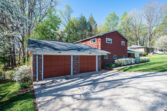 view of property exterior featuring a yard and brick siding
