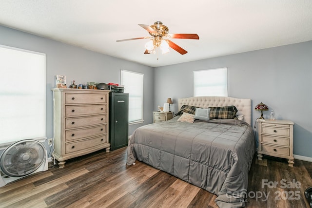 bedroom with ceiling fan and wood finished floors