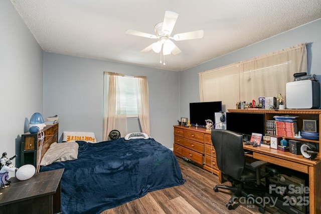 bedroom with wood finished floors and ceiling fan