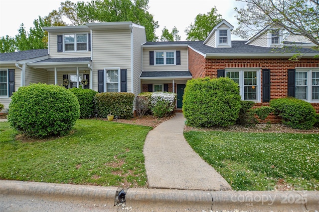 10805 Winterbourne Ct, Charlotte, NC 28277 - view of front of property with a front yard and brick siding