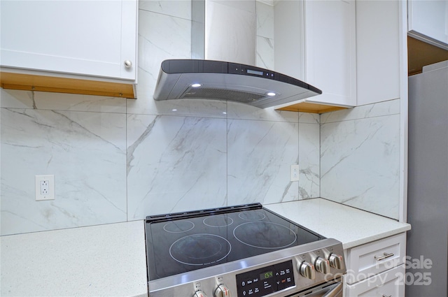 10805 Winterbourne Ct, Charlotte, NC 28277 - room details featuring island range hood, backsplash, white cabinetry, and stainless steel appliances