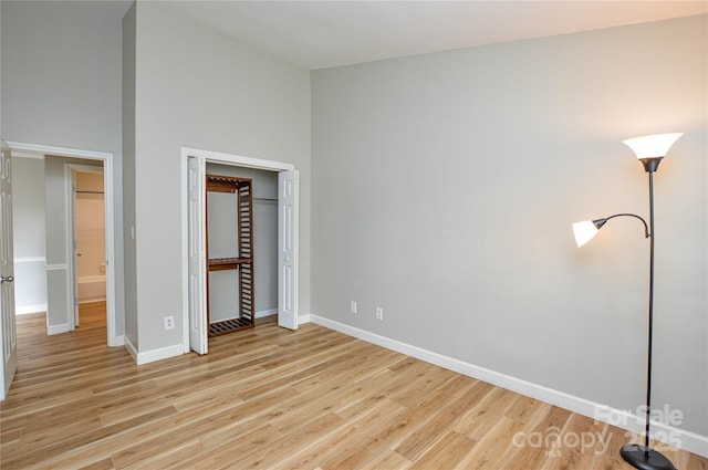 10805 Winterbourne Ct, Charlotte, NC 28277 - unfurnished bedroom featuring a closet, baseboards, and light wood finished floors