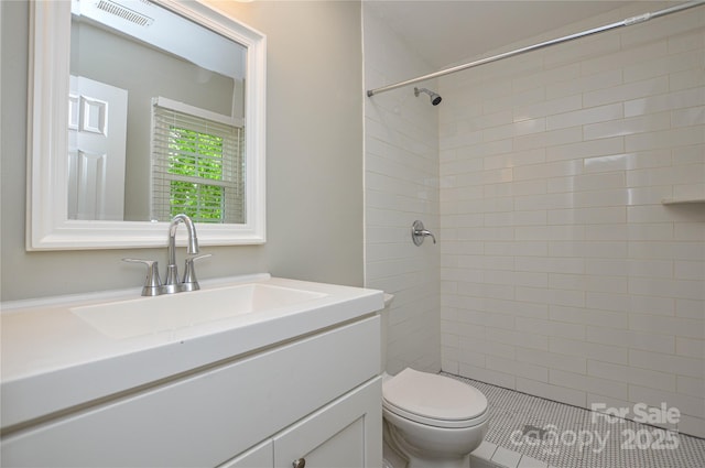 10805 Winterbourne Ct, Charlotte, NC 28277 - full bath with vanity, visible vents, a tile shower, and toilet