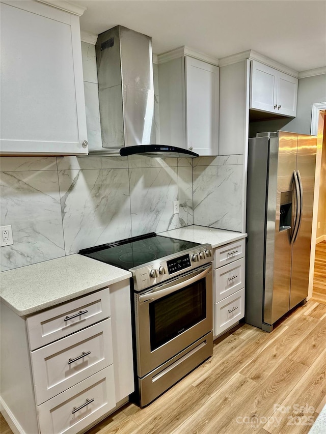 10805 Winterbourne Ct, Charlotte, NC 28277 - kitchen featuring light wood-type flooring, appliances with stainless steel finishes, decorative backsplash, and white cabinetry