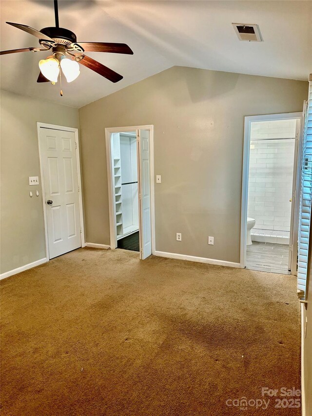 10805 Winterbourne Ct, Charlotte, NC 28277 - unfurnished bedroom with ensuite bathroom, baseboards, carpet, and vaulted ceiling