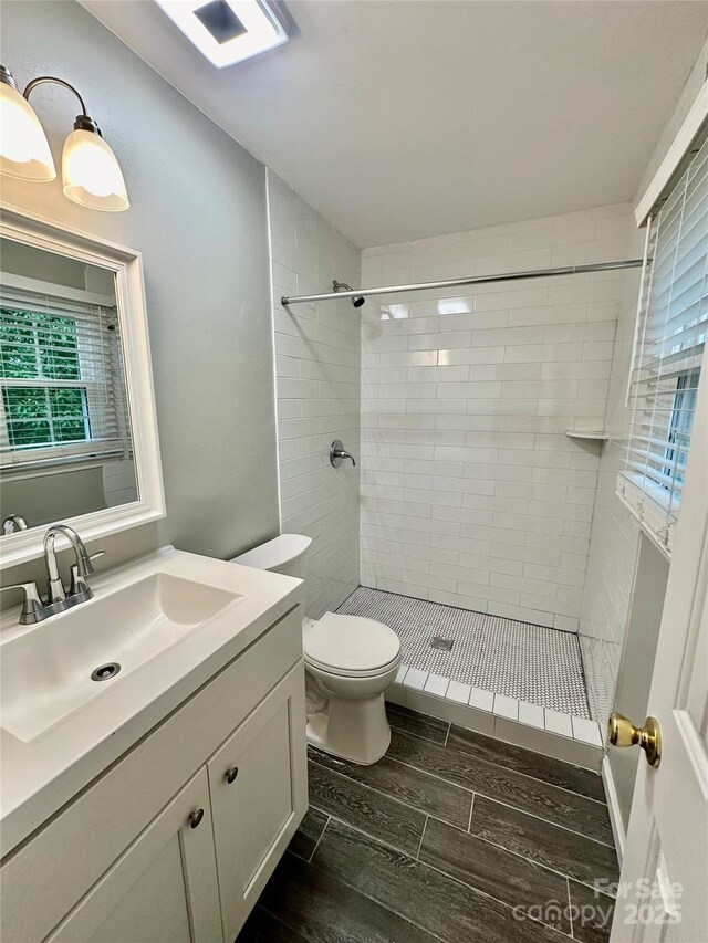 10805 Winterbourne Ct, Charlotte, NC 28277 - bathroom featuring toilet, a stall shower, wood finished floors, and vanity