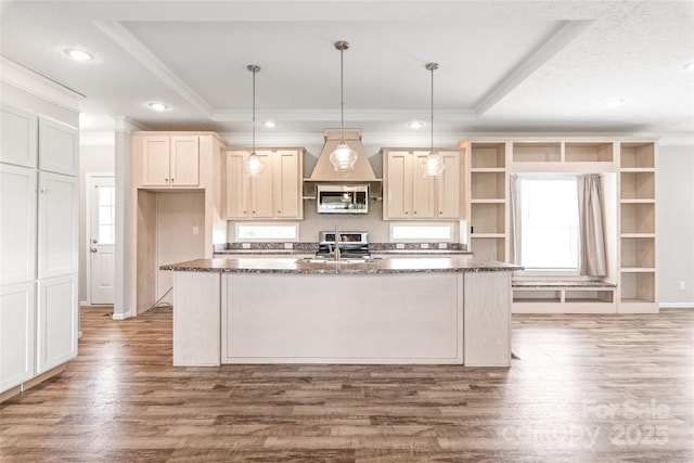 kitchen with a tray ceiling, crown molding, stainless steel appliances, and open shelves