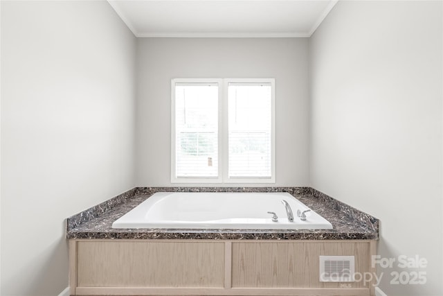 full bathroom featuring crown molding, a garden tub, and visible vents