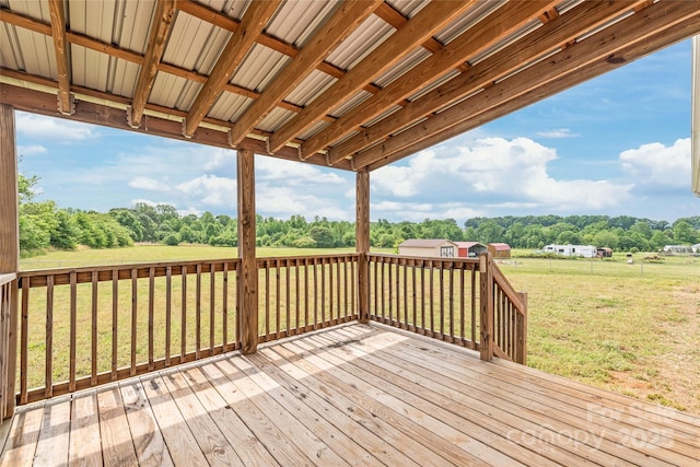 wooden terrace with a lawn