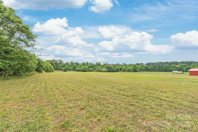 view of yard with a rural view