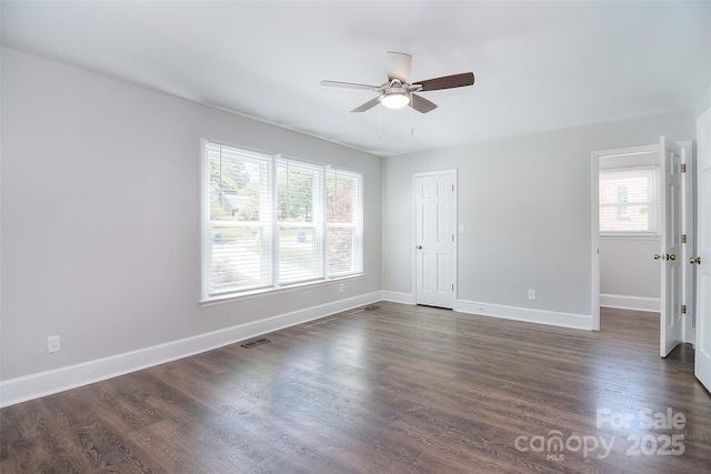 6008 Corkstone Dr, Mint Hill, NC 28227 - spare room featuring a ceiling fan, dark wood-style flooring, and baseboards