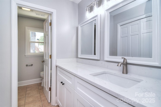 6008 Corkstone Dr, Mint Hill, NC 28227 - bathroom with vanity, toilet, tile patterned floors, and baseboards