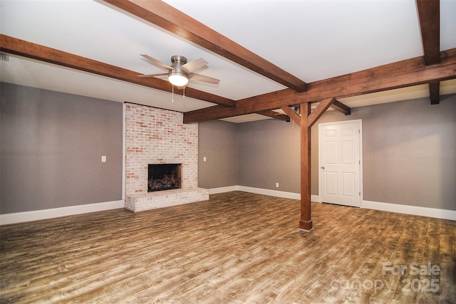 6008 Corkstone Dr, Mint Hill, NC 28227 - unfurnished living room with beamed ceiling, wood finished floors, a ceiling fan, baseboards, and a fireplace