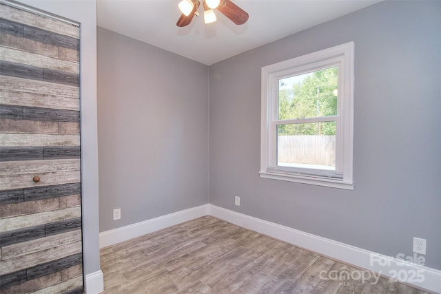 6008 Corkstone Dr, Mint Hill, NC 28227 - spare room featuring ceiling fan, wood finished floors, and baseboards
