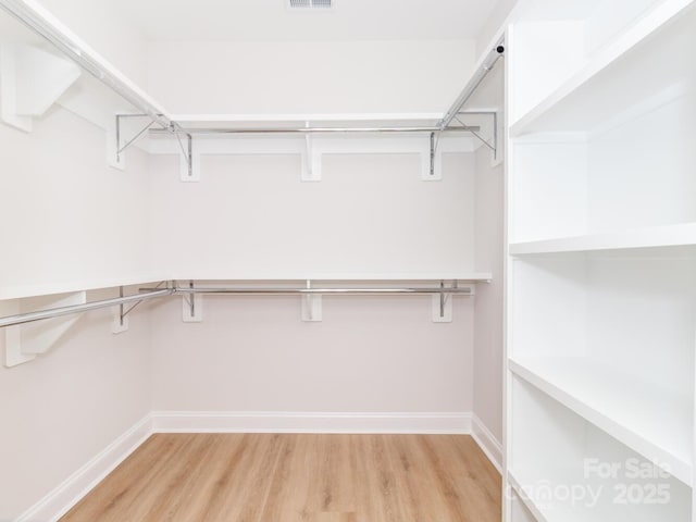 walk in closet featuring light wood-type flooring