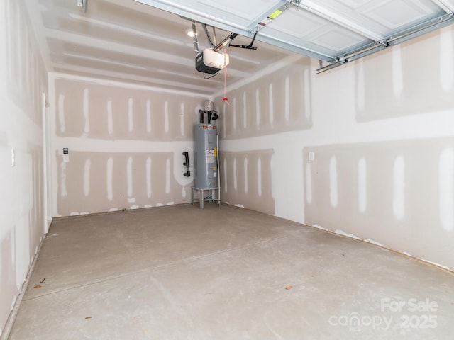 garage featuring electric water heater and a garage door opener