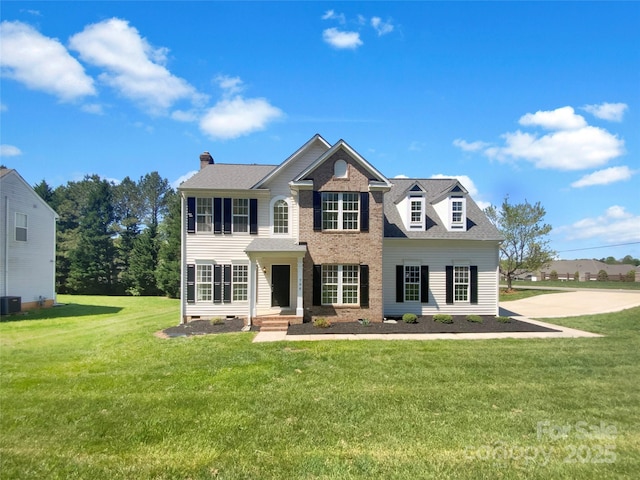 colonial house with crawl space, a chimney, and a front lawn